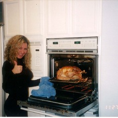 Nina Marie cooking turkey for Thanksgiving
