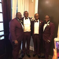 Paul Nkwelle with friends at a wedding