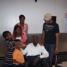 Papa with grand children at the airport