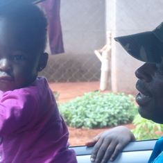 Advocate with Nwanga, trying to teach her how to drive.