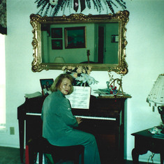 At her piano (1990s)