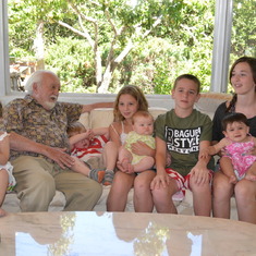 Norman with great grandchildren (L to R, Tamar, Owen, Kylie, Olivia, Austin, Katelynn and Samantha)