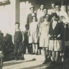 young Norman (far left) with George Davis family.  Parents Beulah and Fletcher Alumbaugh on far right.  (1928)