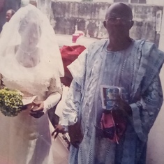 Daddy walking his second daughter (Tope)down the aisle.