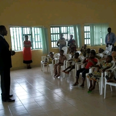 Pastor Dr. Femi talking to the Ophans.