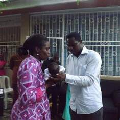 Pastor Femi helping Rev Mrs Adeteju name Joy Abutu's son 10years ago