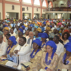 Dr. Femi (2nd right, row 2) with in-laws and guests during his father-in-law's funeral mass. July 2014
