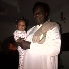 Oluwole with his first Grand child and daughter