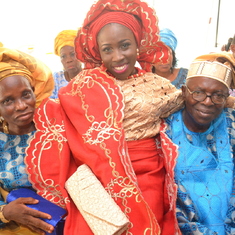 Omoloye recieving his daughter inlaw Adeseye on her wedding day together with his wife