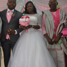 Omoloye and OLalere with his wife on his wedding day