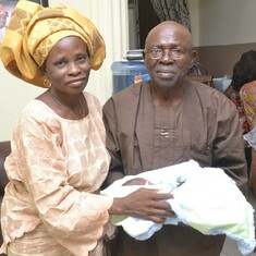 Omoloye with his wife, Aduke during the naming ceremony of his grandchild in 2014