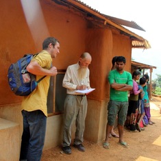 Owen inspecting 30 earthbag houses built by Karisimo in Mulabari, Nepal