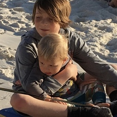 Snuggling cousin Forest in the beach in Florida 