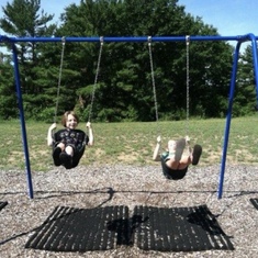 At the playground in traverse city. Uncle casey and i were teaching these guys how to do swing jumps