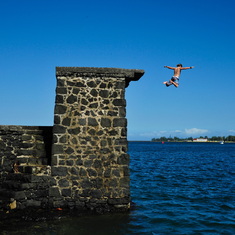 Owen jumping into the sea in Hilo. 2015