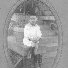 1916-1920?:  Owen Loui on the front step of home on Koko Head Avenue, Kaimuki or possibly Kuakini and Fort Street home.