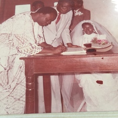Prof oyeleye Oyediran signing our marriage certificate 