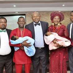 Pastor Chuks, his Pastors with the Ochia's on their babies dedication to God in Church 