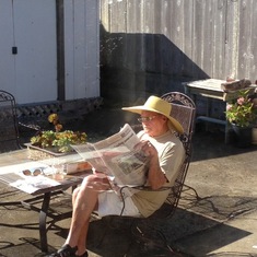 here's how I found UP when I got up in the morning...he had borrowed my reading glasses & sun hat :)