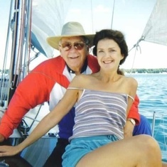 Bud and Susan Decot enjoying sailboat ride. Bill in background. 