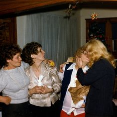 Jealous sisters Earleen and Pat because Mommy is kissing Margie