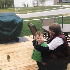 Patricia fishing with her grandson, Logan, at the pond at their house in Indiana