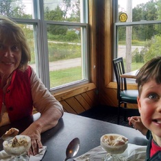 Patricia having ice cream sundaes with her oldest grandson, Logan.