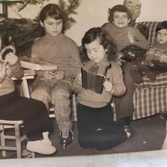 Patricia as a toddler with her siblings
