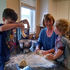 Mom baking buns with her grandchildren Noah and Logan