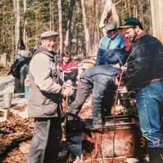 Aunt Pat with Husband Randy & Uncle Goldie helping her brother Kevin in the Maple Bush with...Gerry?