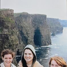 Pat and her girls in Ireland at the cliffs of Moore