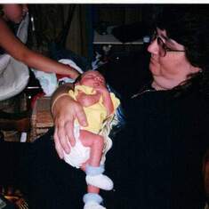 Holding her first Grandchild in 2002