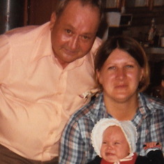 Pat, her father, and baby Crystal.  I love this picture because it is one of the only ones I have with my mom wearing her hair this way - and it is exactly how I wear it.  I do look a lot like her :)