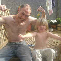 Paddy + Caty Showing Off Their Muscles