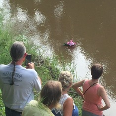 wreath floating down stream with Mom Patty's ashes.1