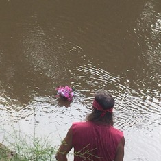 wreath floating down stream with Mom Patty's ashes.2