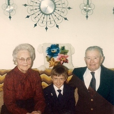 Paul and Grandpa and Grandma Dvorak celebrating his First Communion.