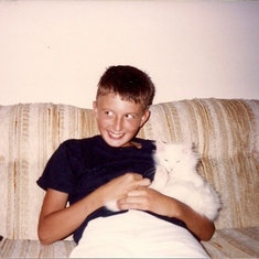 Paul and one of our many cats.