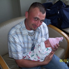 Paul visiting Eden in the hospital after her birth. He had gotten home from Iraq just the month before.