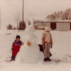 Making a snow bunny on the farm.  (Mom helped a lot.) I would guess that this was after a late spring snowstorm.