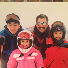 Paul and his kids skiing