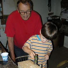 Grandpa and Francesco working on a bird house