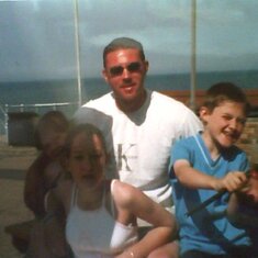 paul and his kids by the sea