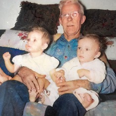 Paul with his twin sister Christy on their grandfather's lap