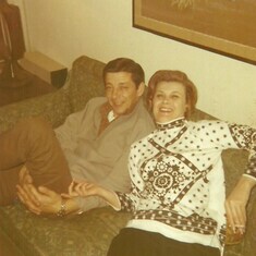 Dad and Mom in the living room.. Mom with her ciggy-butts and gorgeous long nails..envious!