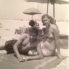Dad and Mom enjoying time on the beach... look at those bathing suits!
