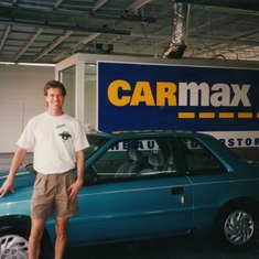 Paul with a new car. He sent this photo to his sister Denise. (date unknown)