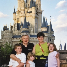 Barbara and Paul with grandkids Brendan, Zoe, and Hannah at Disney world