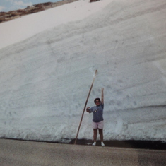Peggie at Rocky Mountain NP measuring the snow on Trail Ridge Road