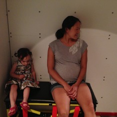 Peggy and Eva at the "Please Touch" museum in Philly, June 2013.  (She's looking at Liam driving the bus to the right.)